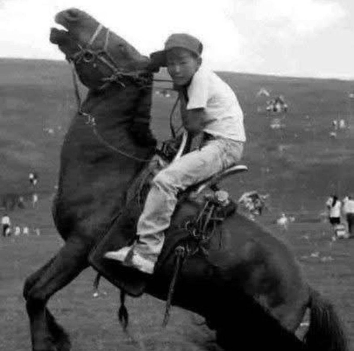 The maker as a boy on a rearing horse at a naadam on the steppe